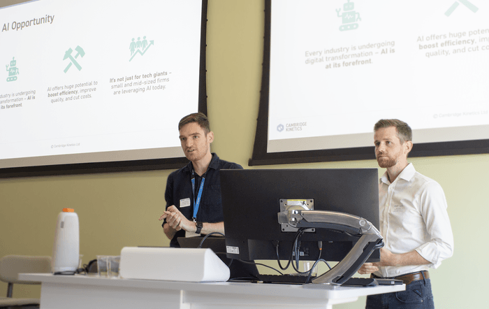 Jason and Mike talking at the event